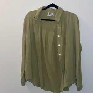 Green button up shirt